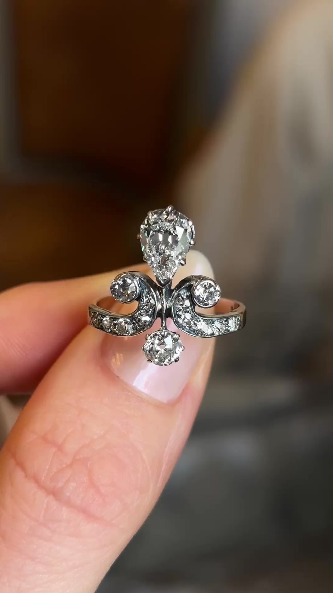 Antique, Edwardian pear cut diamond motif engagement ring