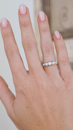 Video of the antique five-stone engagement ring being worn, capturing the lively sparkle of its old-cut diamonds.