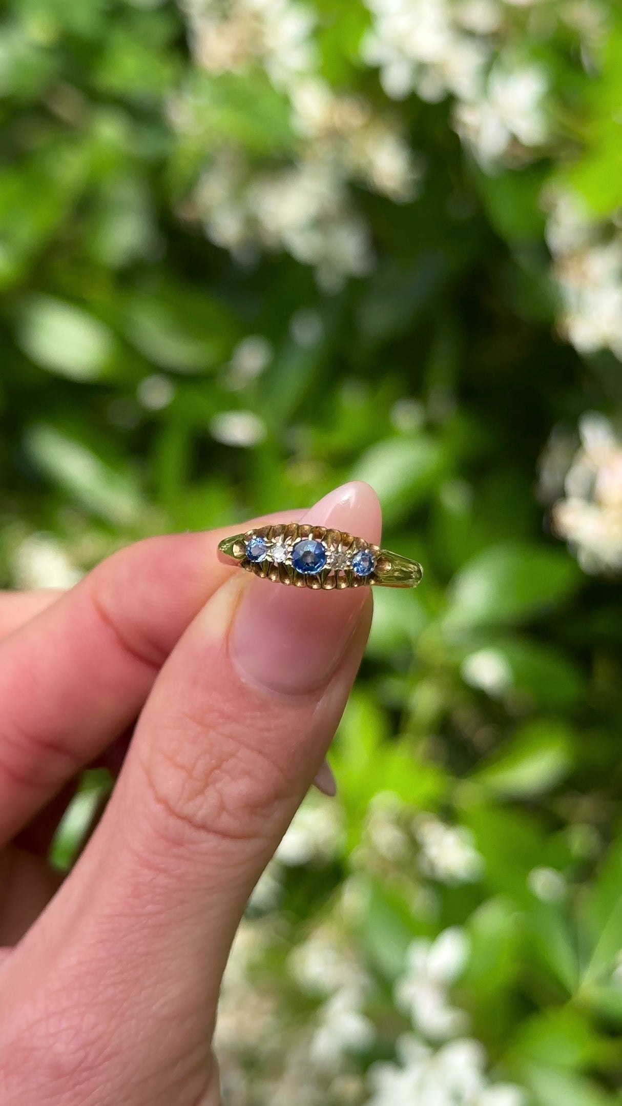 Antique, Edwardian Sapphire and Diamond Five-Stone Ring, 18ct Yellow Gold held in fingers