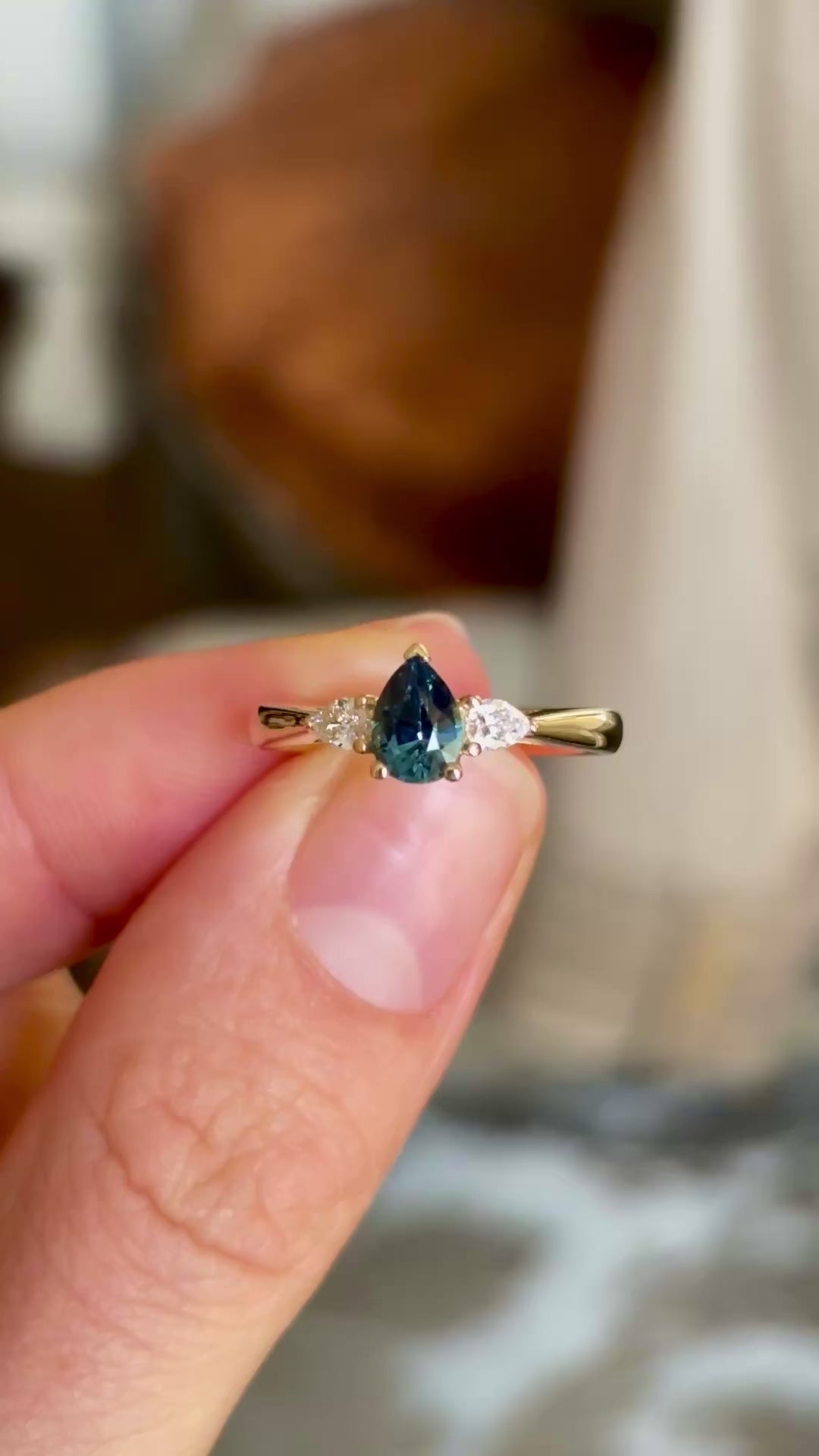 Pear-cut teal sapphire & diamond three-stone ring