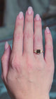 Chocolate brown diamond cluster tre-foil engagement ring worn on hand showing subtle movements. 