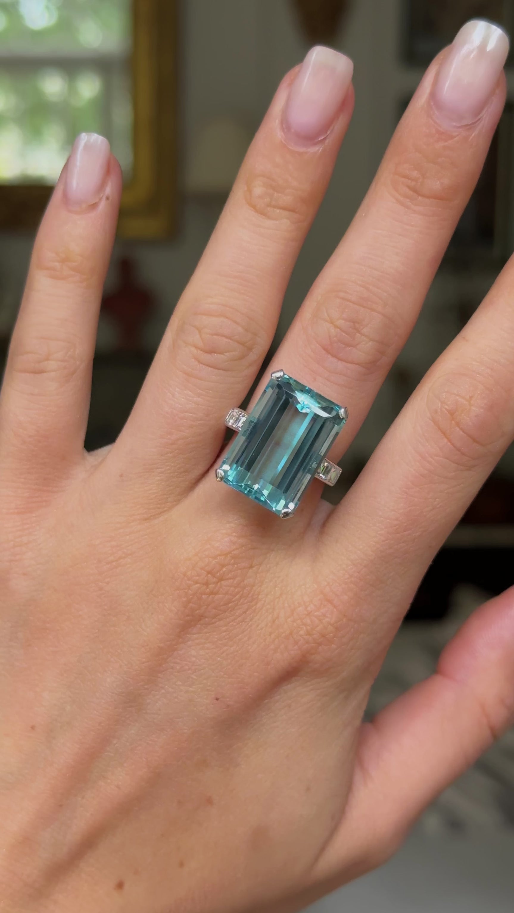 vintage aquamarine and diamond cocktail ring, worn on hand and moved around to give perspective.