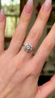 Vintage diamond cluster ring worn on hand and moved around to give perspective.