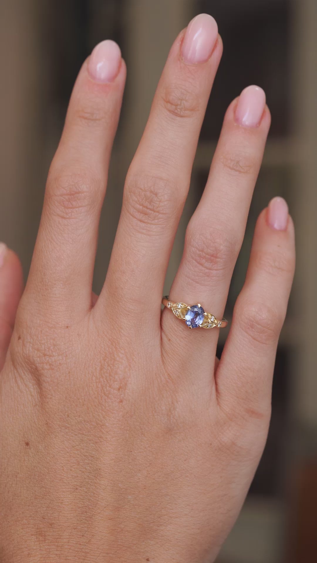 Video showcasing the oval blue sapphire and diamond ring on the hand, capturing the gemstone’s soft blue sparkle.