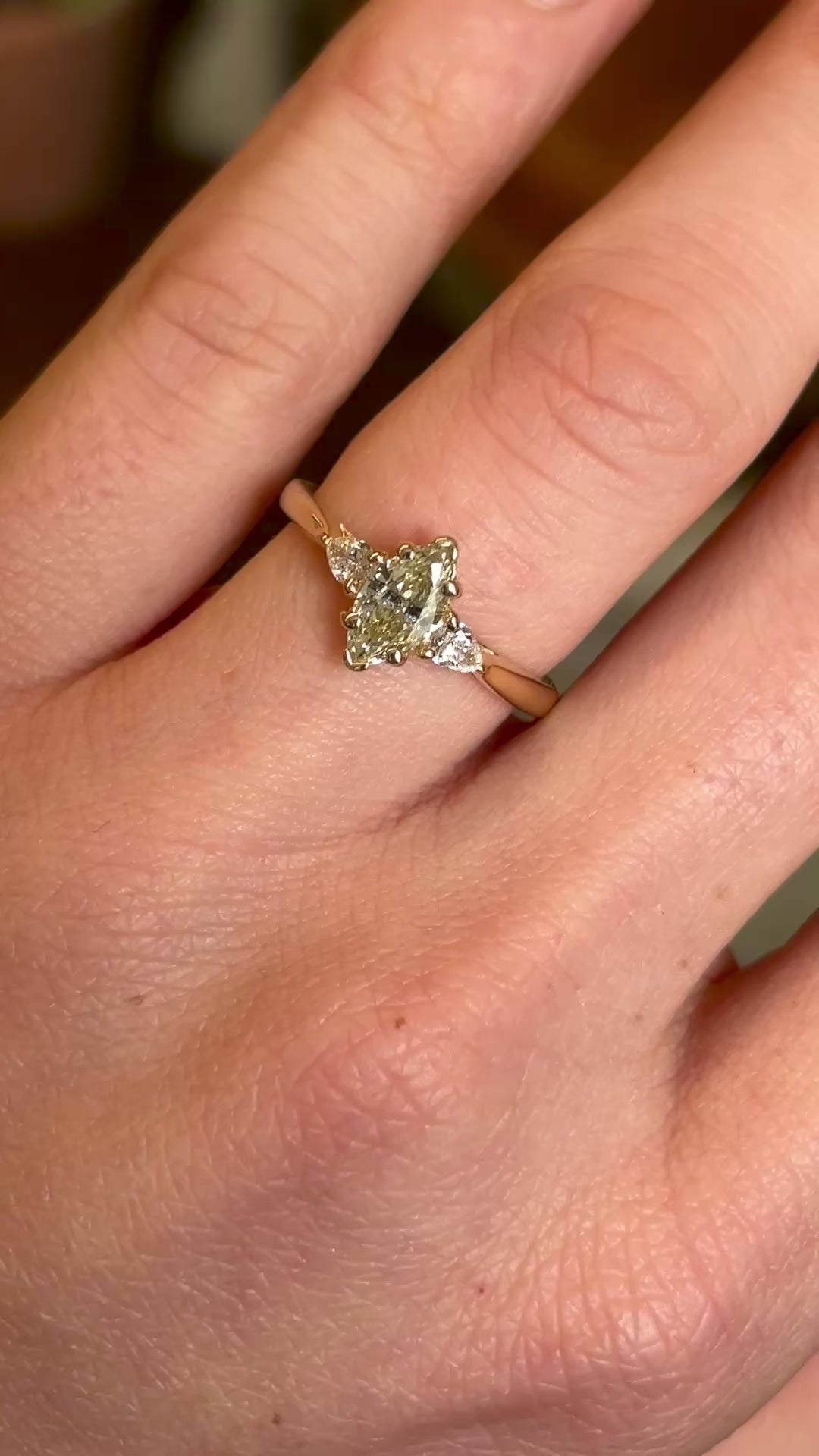 Marquise-cut diamond three-stone engagement ring