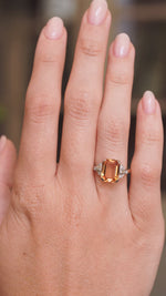 a video of a yellow gold Vintage, 1950s Sherry topaz and diamond cocktail ring worn on the hand.