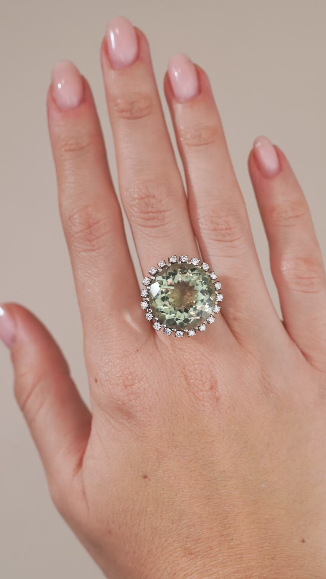 A video of the vintage green quartz and diamond ring being worn, capturing the gemstone's subtle green tones and sparkle.