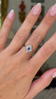 antique edwardian sapphire and diamond kite shaped ring, worn on hand and moved away from lens to give perspective,  front view