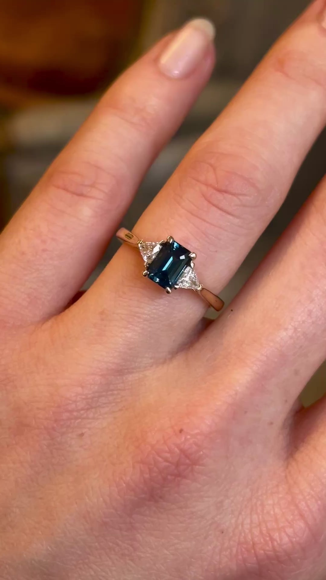 Teal sapphire and diamond three-stone engagement ring