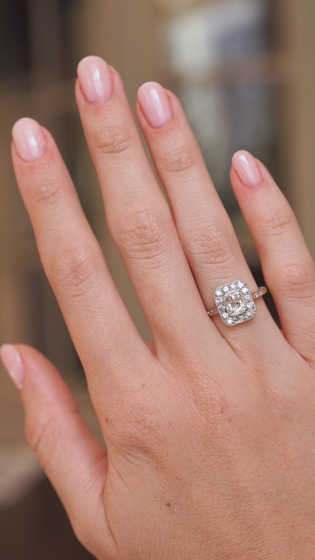 Video of an antique old-mine cut diamond engagement ring worn on the hand, highlighting its sparkle and Edwardian proportions.