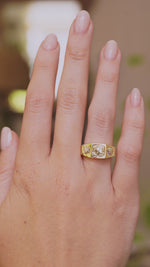 A video of Vintage, 1970s Peruzzi cut diamond three-stone gypsy ring worn on the big hand
