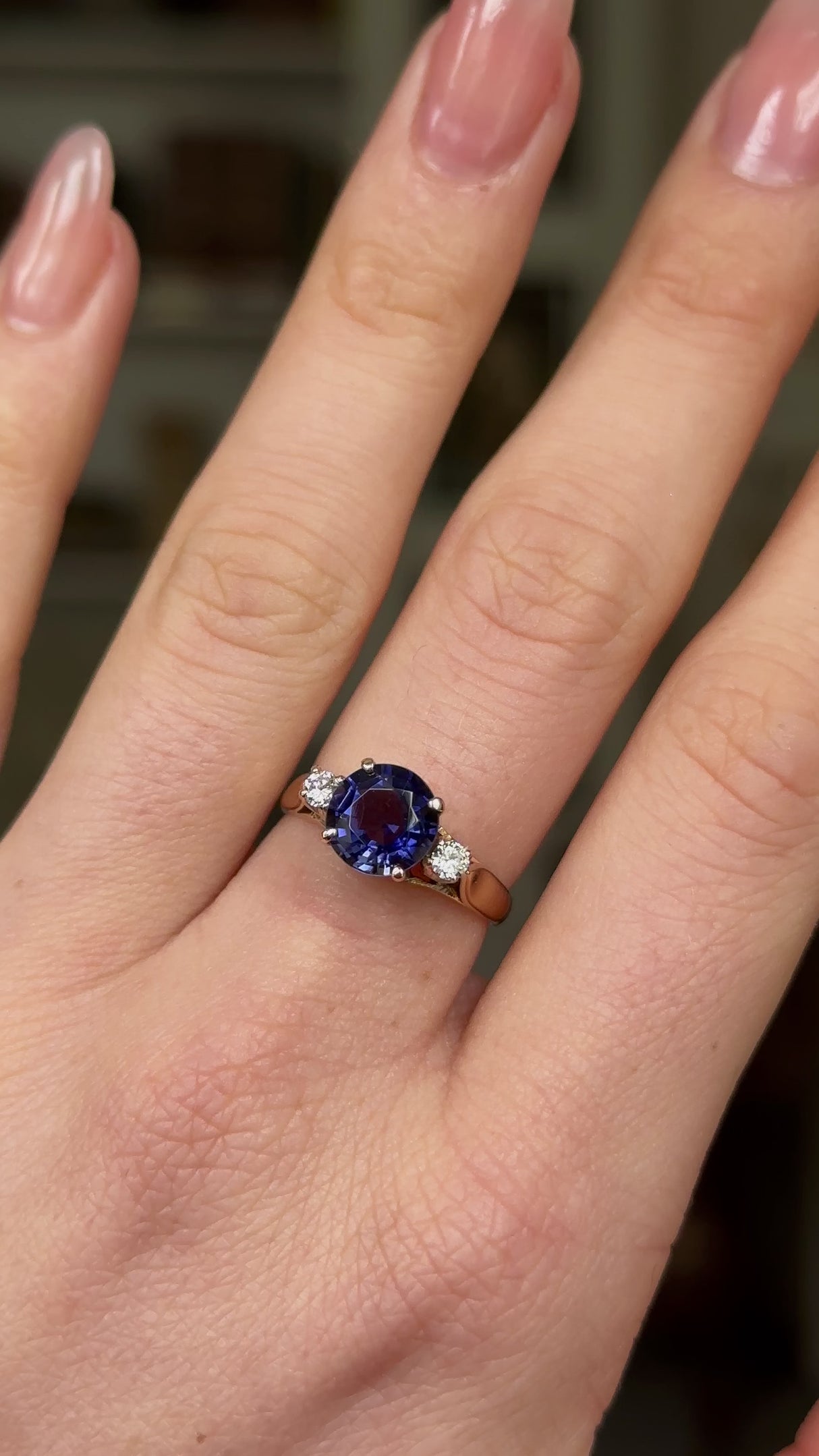 Vintage Iolite and Diamond Three-Stone Engagement Ring, 18ct Yellow Gold worn on hand and rotated to give perspective.