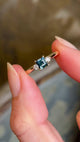 Square-cut teal sapphire and diamond three-stone engagement ring