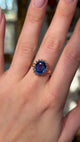 sapphire and yellow gold engagement ring worn on hand and moved around to give perspective. 