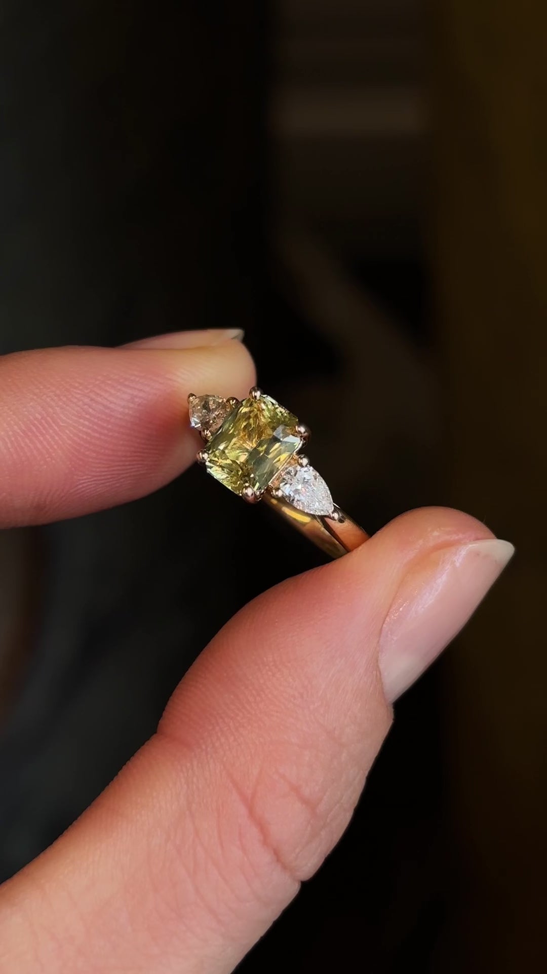 Emerald-cut yellow sapphire and diamond three-stone ring