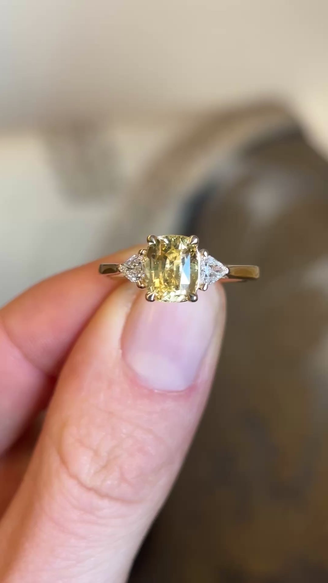 Yellow sapphire and diamond three-stone ring