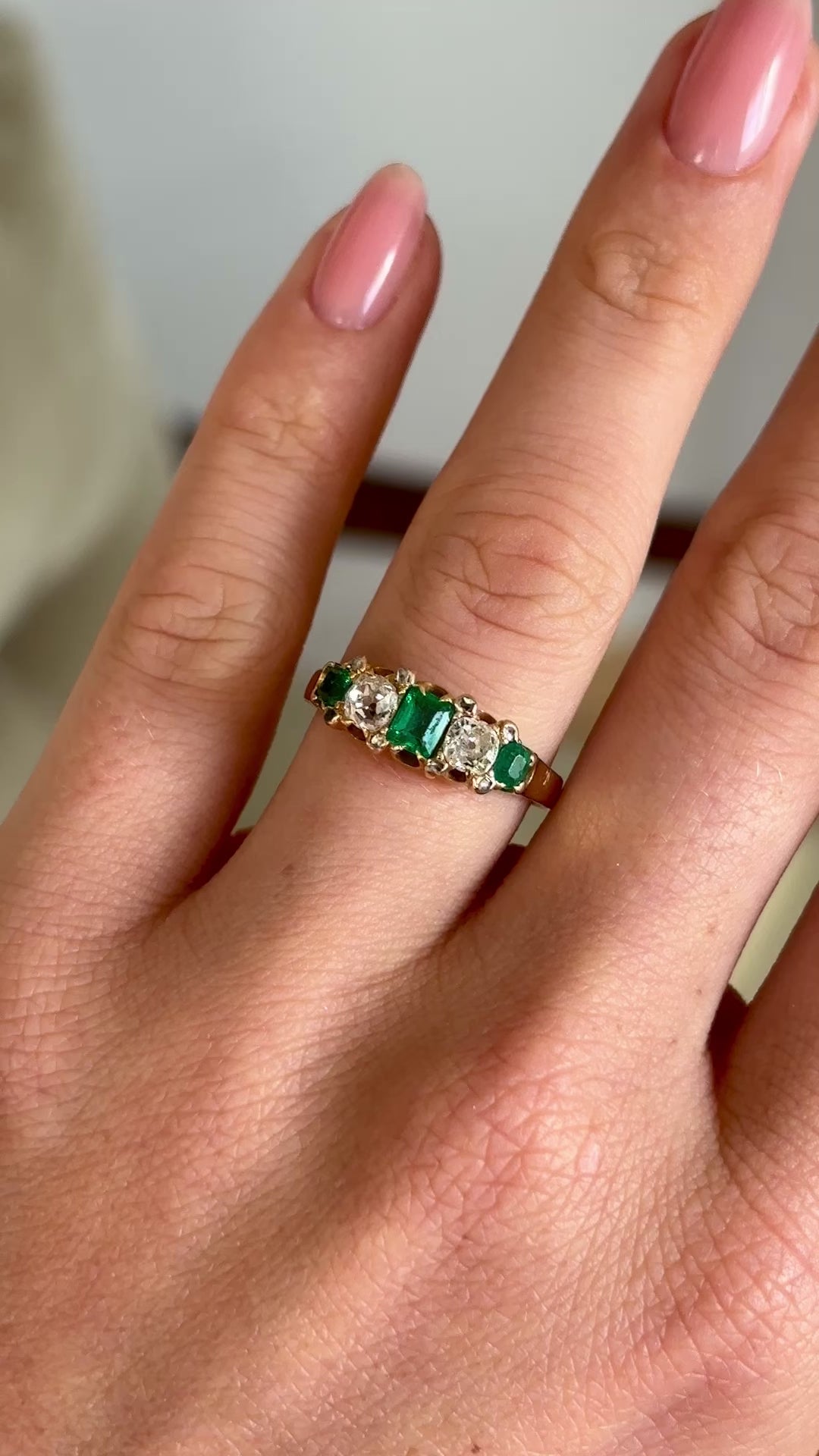 Vintage, Art Deco emerald & diamond five-stone ring worn on hand