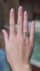 Green sapphire and diamond cluster engagement ring