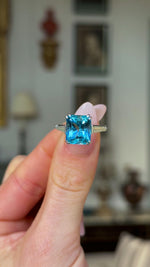 Vintage, Art Deco Topaz and Diamond Ring, Platinum held in fingers and rotated to give perspective. 