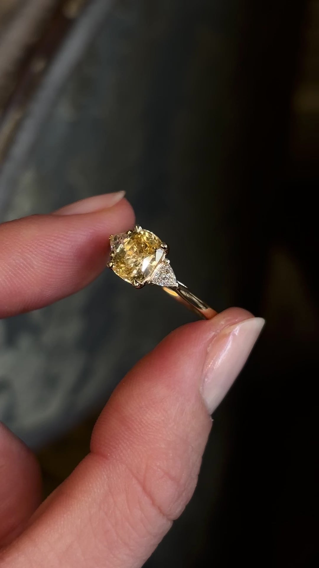 Yellow sapphire and diamond three-stone ring