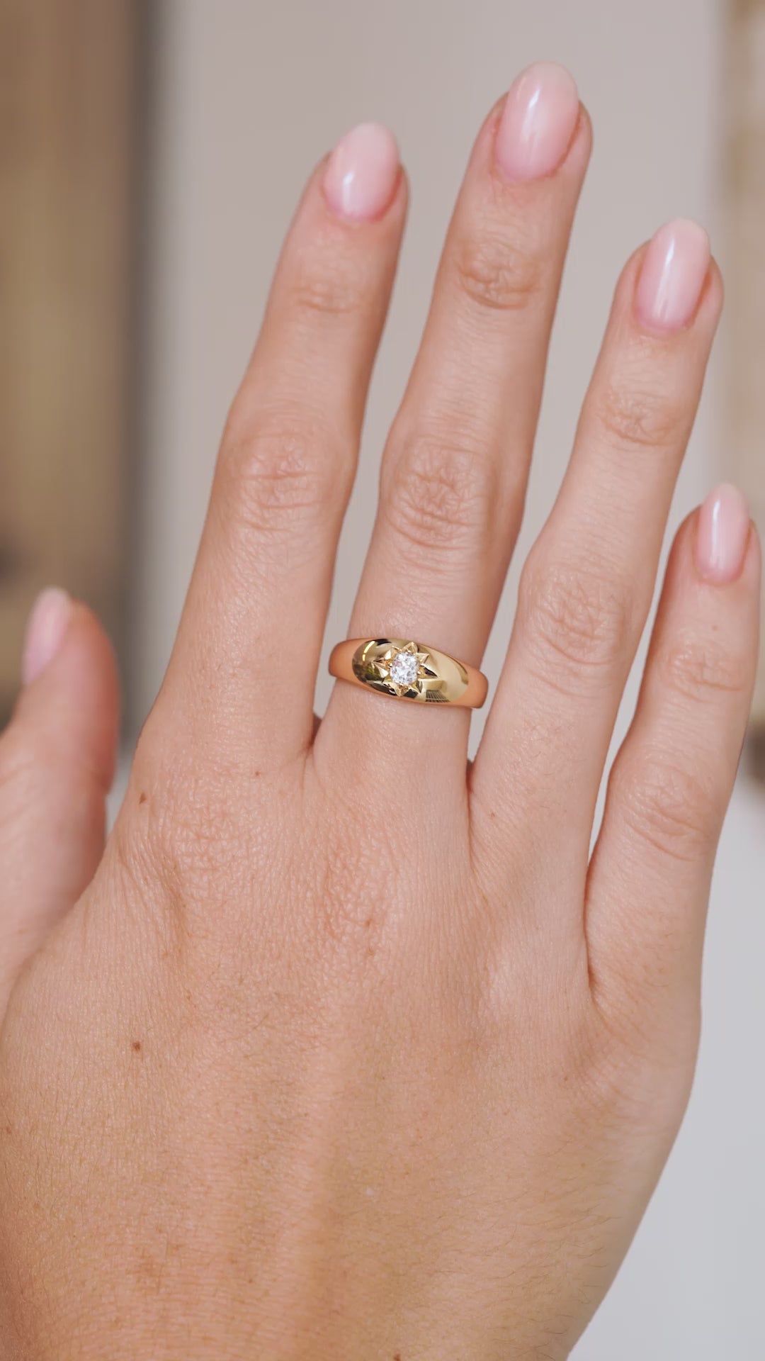 Video of the Victorian diamond solitaire ring on the hand, capturing the polished gold and antique stone’s sparkle.