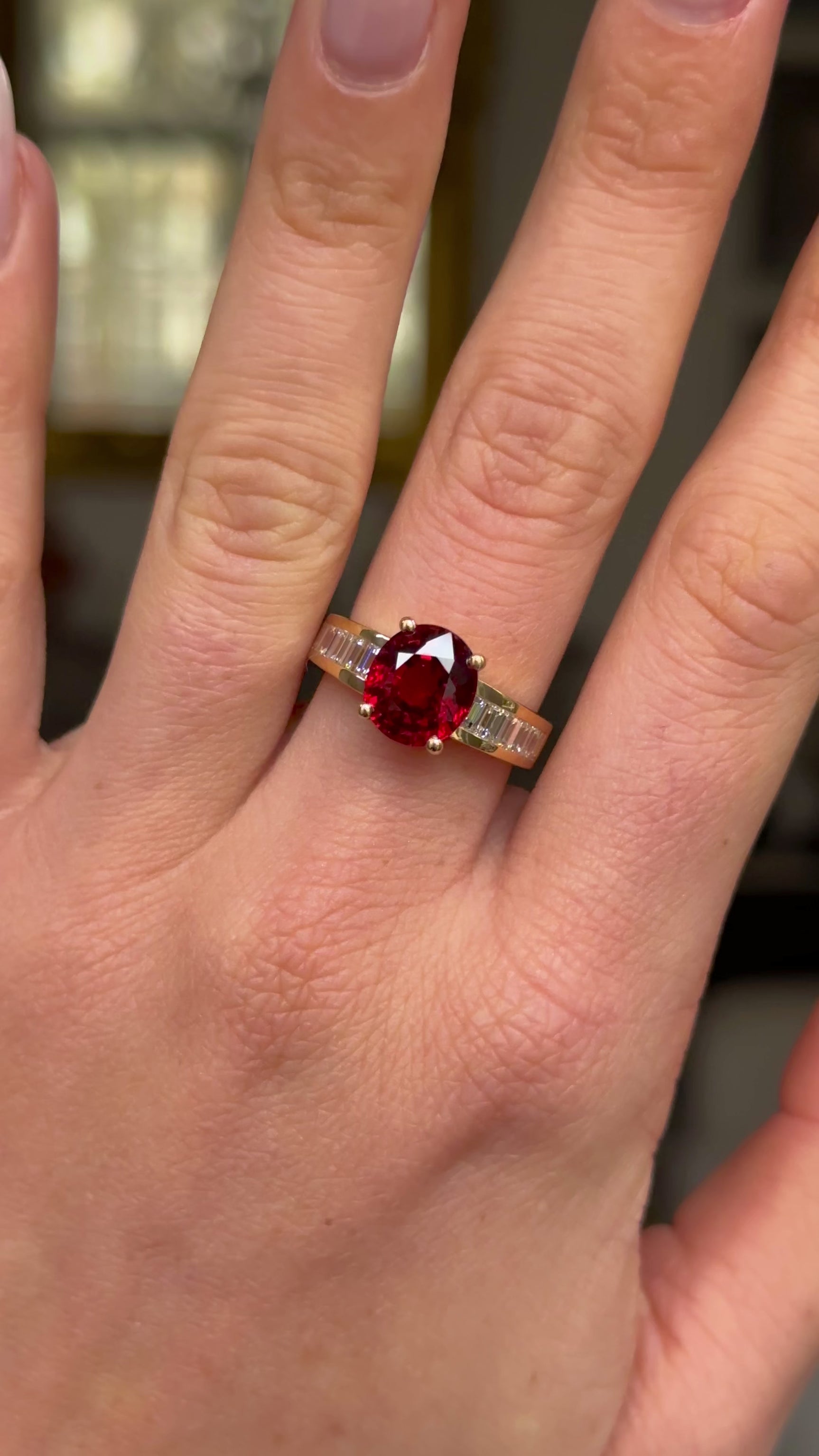 Art Deco spinel and diamond ring worn on hand and moved around to give perspective.