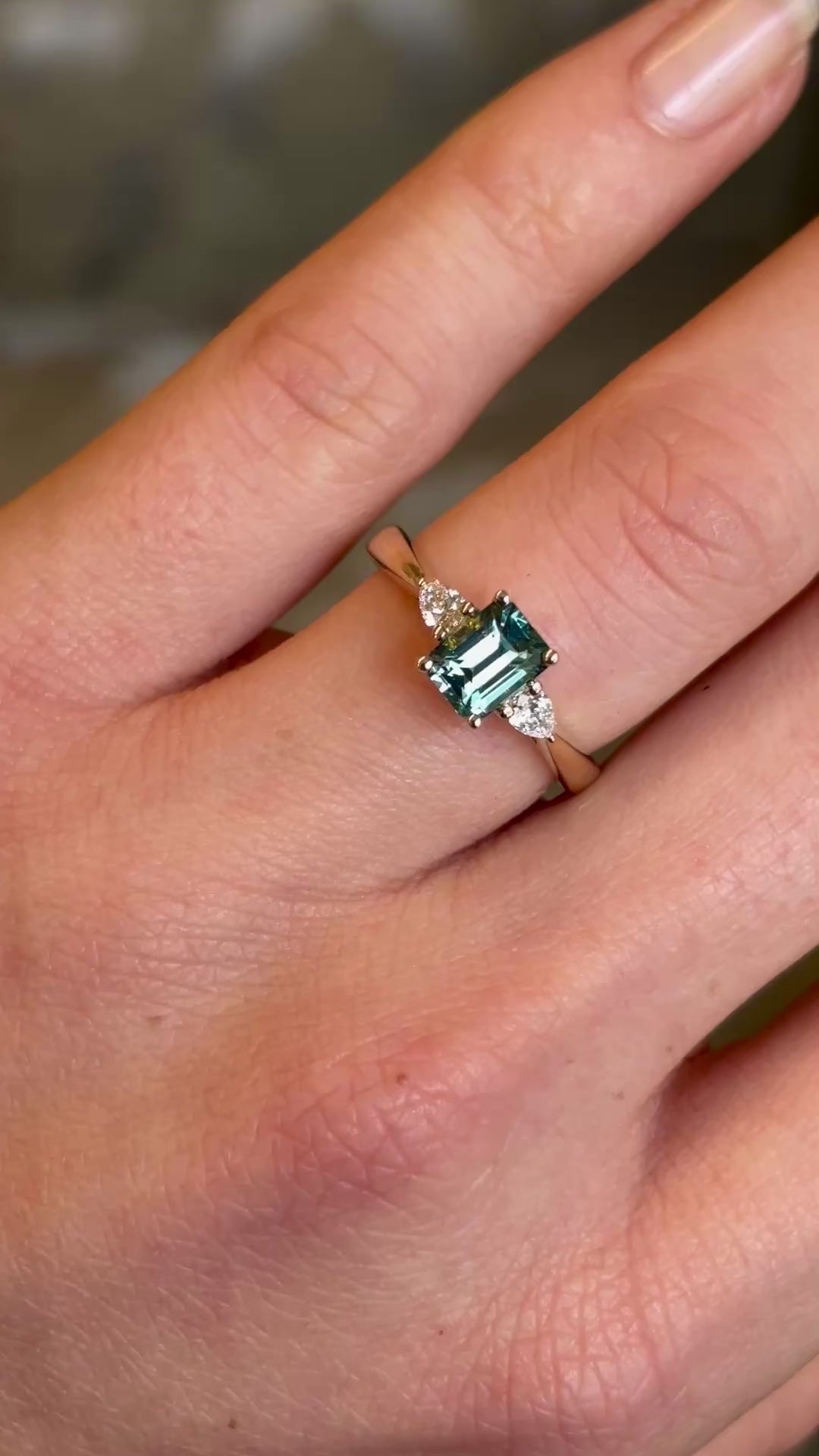 Green sapphire and diamond three-stone engagement ring