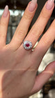 Antique victorian ruby and diamond cluster engagement ring worn on hand and moved around to give perspective.