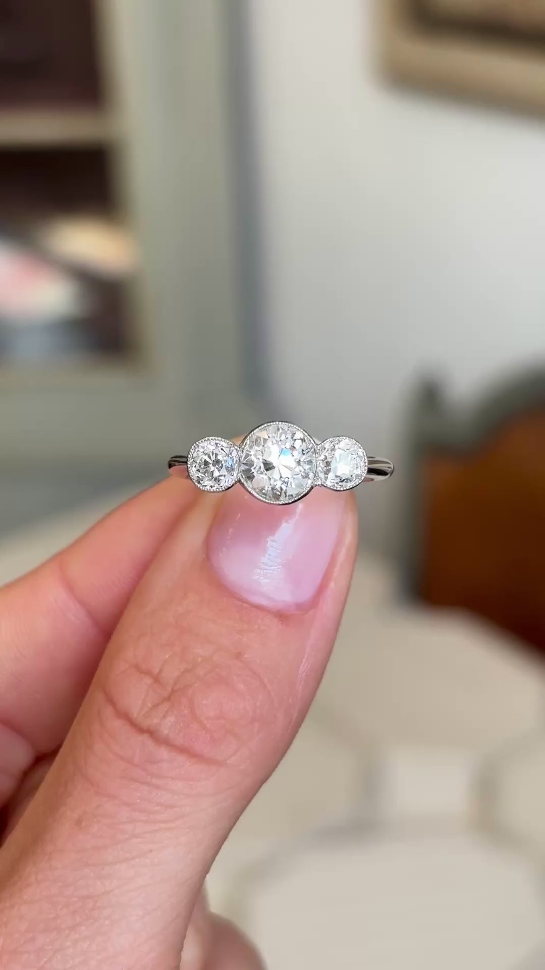 Video showcasing the profile of an Antique, Art Deco old-cut diamond three-stone engagement ring in platinum