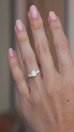 Video of an oval pale yellow diamond engagement ring worn on a finger, capturing its sparkle and delicate design.