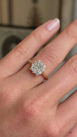 Video of an Antique-inspired, princess-cut diamond cluster engagement ring in yellow gold worn on a hand. 