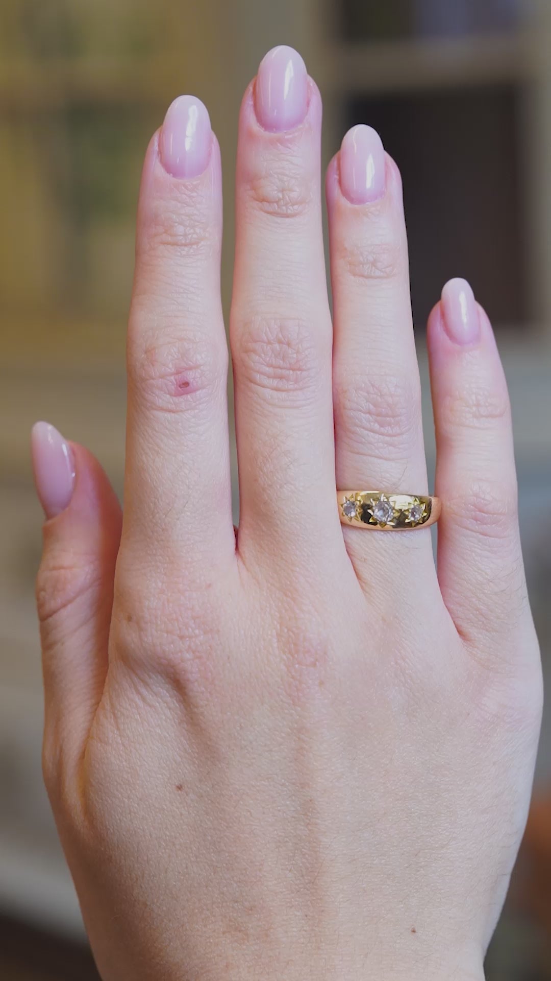 Antique Edwardian old-mine cut diamond gypsy ring worn on hand in motion.