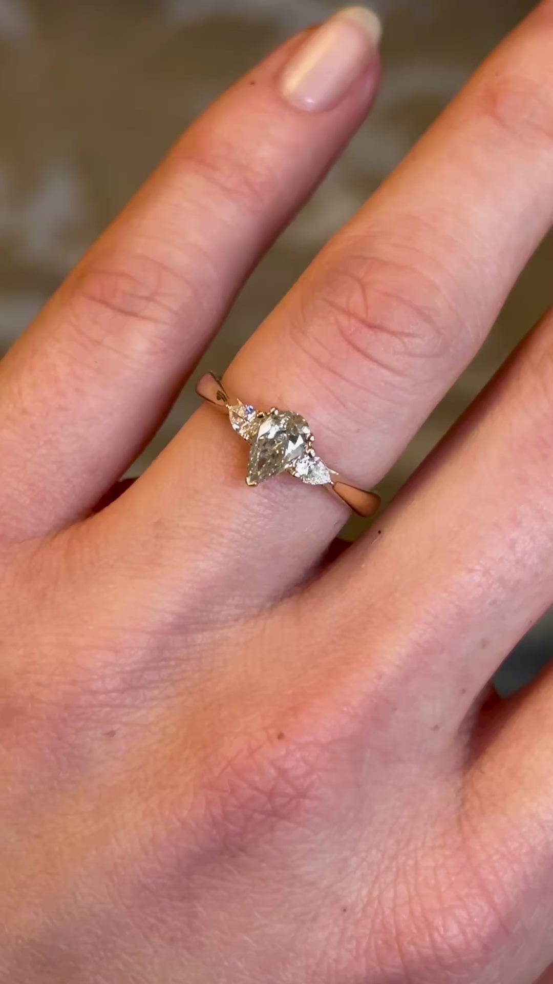 Pear-cut diamond three-stone engagement ring