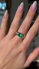 Vintage emerald and diamond band worn on hand and moved around to give perspective.