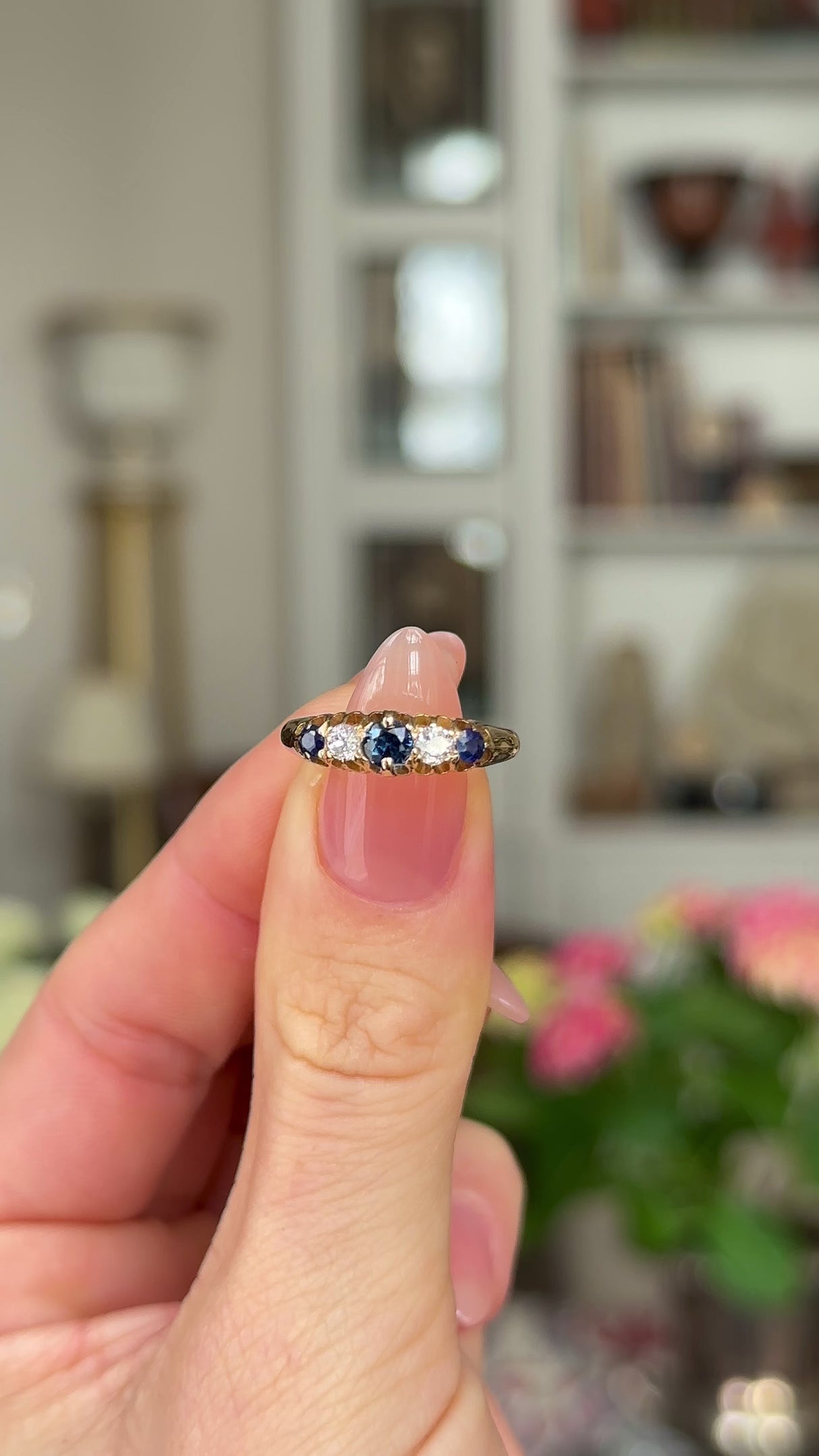 Antique, Edwardian Sapphire and Diamond Five Stone Ring, 18ct Yellow Gold held in fingers and moved around to give perspective.