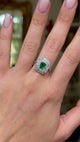 Vintage emerald and diamond cluster ring, worn on hand and moved around to give perspective.