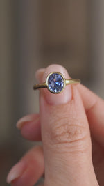 Video presenting the oval sapphire ring balanced on a fingertip as light moves across the gemstone’s facets.