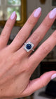 sapphire and diamond panel ring worn on hand moving around to give perspective.