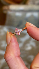 Blush-pink and apricot-orange sapphire three-Stone engagement ring