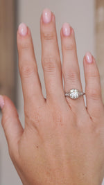 Video of the antique diamond engagement ring on the hand, capturing the character of its old-mine cut centre stone.