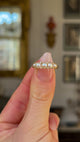 Antique, Victorian Pearl and Diamond Half Hoop Ring, 18ct Yellow Gold held in fingers and rotated to give perspective.