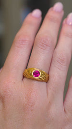 A video of a Art Nouveau antique natural ruby single-stone yellow gold ring worn on the hand and shown at a distance. 