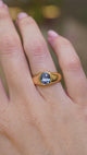 A video of an antique Victorian colour-change sapphire gypsy ring worn on the hand showing a close-up and further away views. 