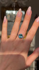 Art deco zircon and diamond ring worn on hand and moved around to give perspective,