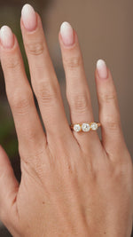 Video of a vintage diamond three-stone engagement ring worn on the hand, highlighting the sparkle and proportions of its antique-cut diamonds.