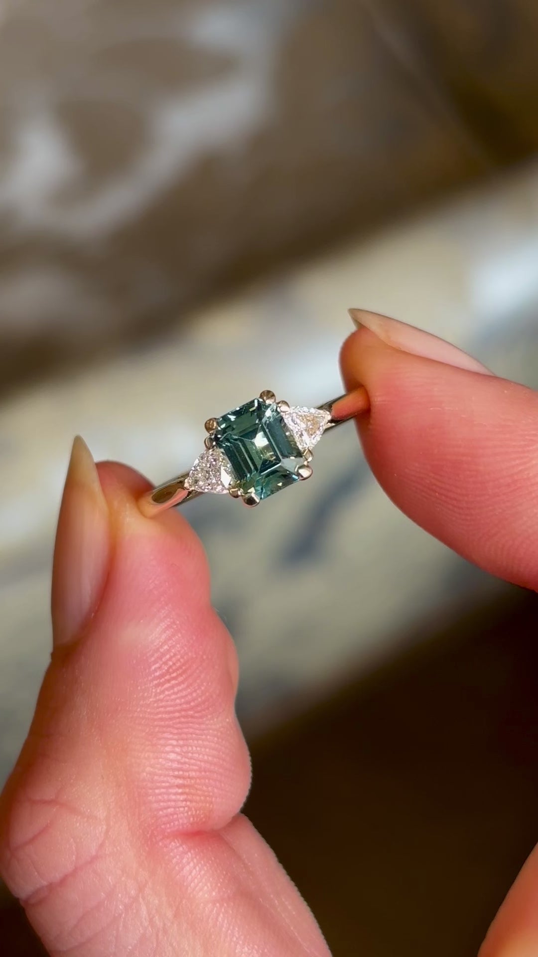 Green sapphire and diamond three-stone engagement ring