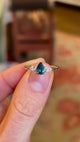Pear-cut teal sapphire & diamond three-stone engagement ring