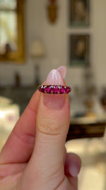 Antique, Edwardian Five Stone Ruby Ring, Yellow Gold held in fingers and rotated to give perspective.