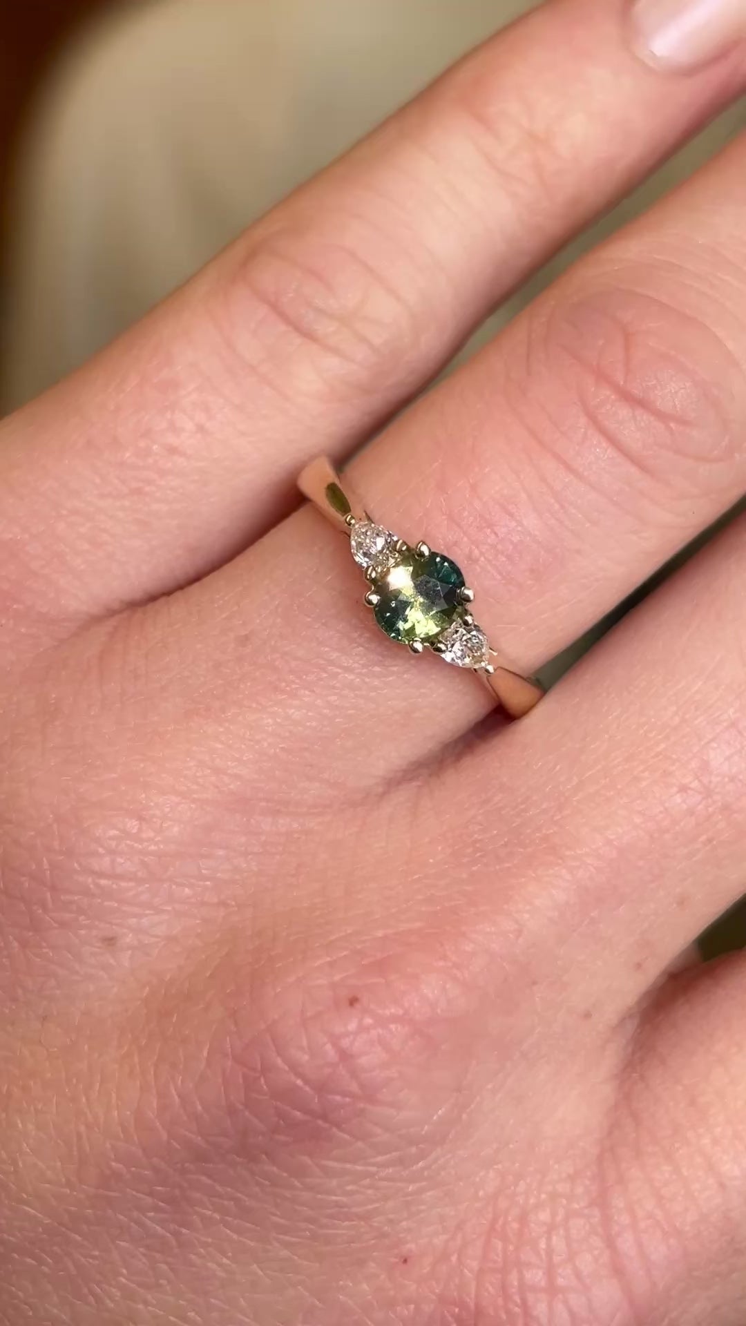 Teal sapphire and diamond three-stone engagement ring