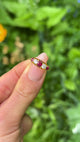 Antique, Victorian Five Stone Ruby and Diamond Ring, 18ct Yellow Gold held in fingers.